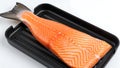 Raw salmon fillet in black tray on white background Royalty Free Stock Photo