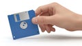 Hand holding floppy disk isolated on white background Royalty Free Stock Photo