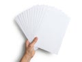 Hand holding stack of white paper sheets isolated on white background Royalty Free Stock Photo