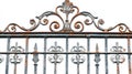Ornate wrought iron gate with intricate designs. The unique patterns are captivating and tell a story of artistry. A Royalty Free Stock Photo