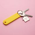 Keychain with house key isolated on white background Royalty Free Stock Photo