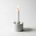 Lit candle in holder isolated on white background Royalty Free Stock Photo