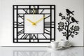 The image features a meticulously crafted wall clock, set against a pristine white backdrop. Royalty Free Stock Photo