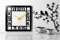 The image features a meticulously crafted wall clock, set against a pristine white backdrop. Royalty Free Stock Photo