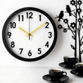 The image features a meticulously crafted wall clock, set against a pristine white backdrop. Royalty Free Stock Photo