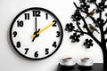 The image features a meticulously crafted wall clock, set against a pristine white backdrop. Royalty Free Stock Photo