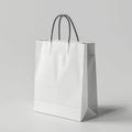 Blank white shopping bag on a gray background Royalty Free Stock Photo