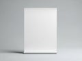 A sleek white rectangular object standing upright against a gray background Royalty Free Stock Photo
