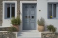 Contemporary Residential Entrance with Gray Front Door and Decorative Windows