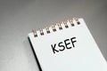 The image features a notebook with the acronym KSEF prominently written on the front cover. This notebook serves as a us Royalty Free Stock Photo
