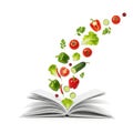 Floating vegetables over open book isolated on white background Royalty Free Stock Photo