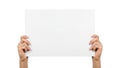 Hands holding blank paper sheet isolated on white background Royalty Free Stock Photo