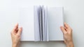 Hands holding open book isolated on white background Royalty Free Stock Photo