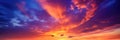 fiery sunset vast sky. Royal blue, orange and yellow sky. Dusk, twilight, early morning, sunrise. Royalty Free Stock Photo