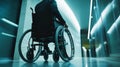 A person in a wheelchair is seen from behind. The setting is modern and sleek. The image captures resilience and Royalty Free Stock Photo