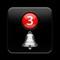 Red button with number 3 and bell icon isolated on black background Royalty Free Stock Photo