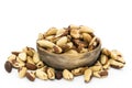 Wooden Bowl Full of Brazil Nuts on a White Background Royalty Free Stock Photo