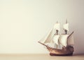 The image features a sailboat model with a minimalist aesthetic on a white background in a studio setting Royalty Free Stock Photo