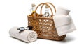 Spa essentials in a woven basket on a clean white background for relaxation Royalty Free Stock Photo