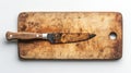 A beautifully crafted wooden cutting board showcases a sharp kitchen knife. Perfect for cooking enthusiasts and culinary Royalty Free Stock Photo