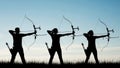 Silhouettes of archers aiming, isolated on white background Royalty Free Stock Photo