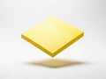 A bright yellow square block casting a subtle shadow on a plain background isolated on white background Royalty Free Stock Photo