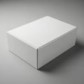 A clean minimalist white cardboard box rests on a neutral gray surface Royalty Free Stock Photo