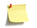 Yellow post-it note with red pushpin isolated on white background Royalty Free Stock Photo