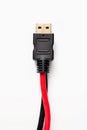 Isolated black and red computer cable on a clean white background Royalty Free Stock Photo