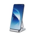Smartphone on stand isolated on white background Royalty Free Stock Photo