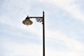 Vintage Street Lamp Against a Soft Blue Sky
