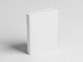 A pristine white box standing alone on a light-colored surface Royalty Free Stock Photo