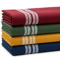 Stack of colored fabrics with patterned edges isolated on white background Royalty Free Stock Photo