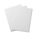 A stack of three blank white sheets of paper on a white background isolated on transparent background Royalty Free Stock Photo