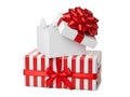Stack of gift boxes with red bows isolated on white background Royalty Free Stock Photo