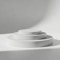 Stack of white ceramic plates isolated on white background Royalty Free Stock Photo
