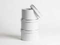 Stack of white cylindrical containers isolated on white background Royalty Free Stock Photo