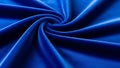 A vibrant blue fabric with a swirling pattern and smooth texture Royalty Free Stock Photo