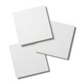 Three blank sheets of paper isolated on white background Royalty Free Stock Photo