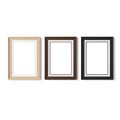 Three empty picture frames in different wood tones on a white background Royalty Free Stock Photo