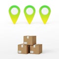 Three green location pins above stacked brown cardboard boxes Royalty Free Stock Photo