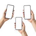 Three hands holding smartphones isolated on white background Royalty Free Stock Photo