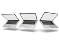 Three laptops in different angles isolated on white background Royalty Free Stock Photo