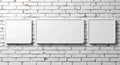 Three blank white frames on a textured brick wall Royalty Free Stock Photo
