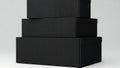 Stack of Three Black Boxes on a Clean Background Royalty Free Stock Photo