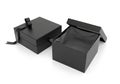 Two black gift boxes, one open isolated on white background Royalty Free Stock Photo