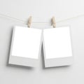 Two blank notes hanging on clothespins, isolated on white background Royalty Free Stock Photo
