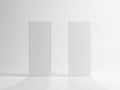 Two blank white rectangular blocks standing upright isolated on white background Royalty Free Stock Photo