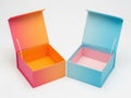 Two open colored boxes isolated on white background Royalty Free Stock Photo