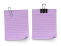 Two purple post-it notes with office supplies isolated on white background Royalty Free Stock Photo